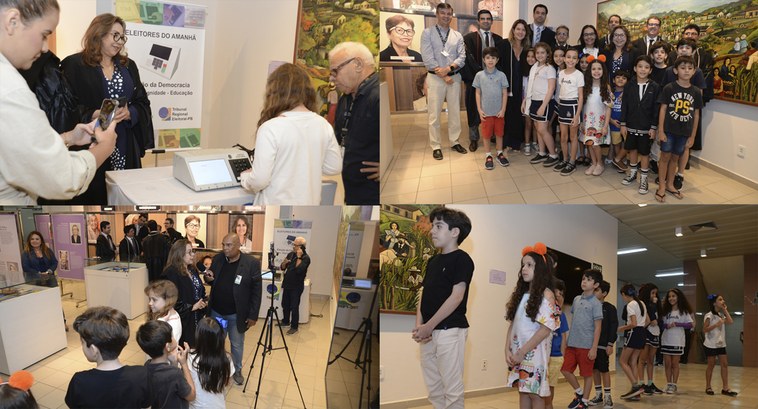 ELEITORES DO AMANHÃ: TRE-PB promove ação educativa dirigida a crianças (1) #PraTodosVerem: Na fotografia aparece crianças em uma fila, ao fundo uma mesa com uma urna eletr...