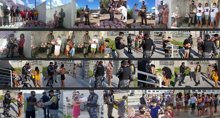 #PraCegoVer: Na fotografia aparece Policiais Militares entregando cestas básicas no Conjunto Már...